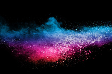 abstract colored dust explosion on a black background.