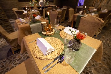 table setting with blank menu card in fancy restaurant