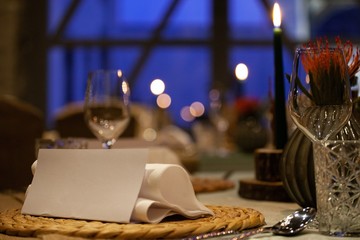 table setting with blank menu card in fancy restaurant