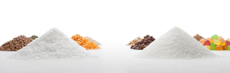 Heaps of salt and sugar on a background of thematically similar heaps