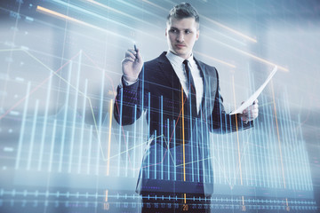 Businessman and forex graph hologram. Double exposure. Concept of financial education and analysis