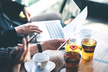 Two business people discussing work in the cafe.