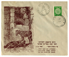 Yavneh, Israel - 7 Decemer 1949: Israeli historical envelope: cover with cachet First day of opening post office, donkeys rest in the shade of ancient ruins