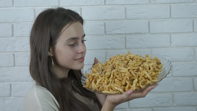 Girl with oriental sweets.