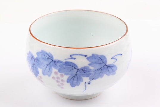 Asian ceramics tea cups set on white background