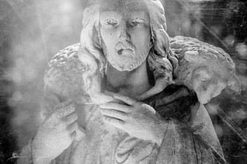 Good Shepherd Jesus Christ. Retro image of antique statue.