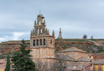 Fototapeta na wymiar Church of Santa María la Mayor in Ayllón in the background sculpture the Sacred Heart of Jesus (Segovia, Spain)