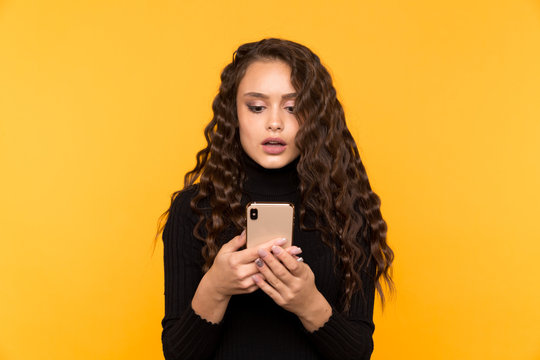 Scared And Surprised Woman Holding Phone Isolated