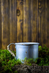 Obraz premium Vintage coffee mug in moss