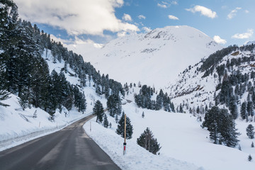 Alpine road in to the mountains. The Kaunertaler Gletscher road in Kaunertal, Tyrol, Austria, climbs from 1300 m to 2750 m and is accessible even in wintertime.  - obrazy, fototapety, plakaty