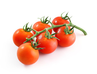 Branch of red ripe tomatoes isolated on white background