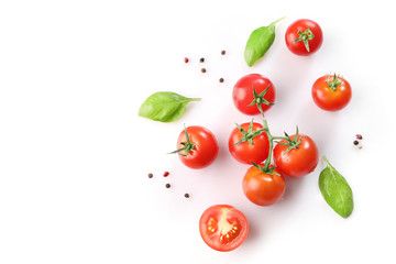 Ripe red cherry tomatos  and basil on white background. Top view - obrazy, fototapety, plakaty