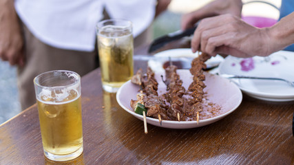 Celebrate with beer and barbecue on the table during the New Year.