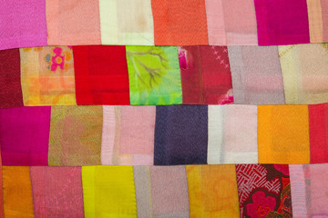 Colorful vintage patchwork of fabrics.