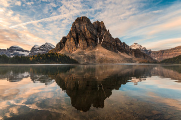 Fototapeta premium Rocky mountain reflection on Cerulean lake in Assiniboine provincial park