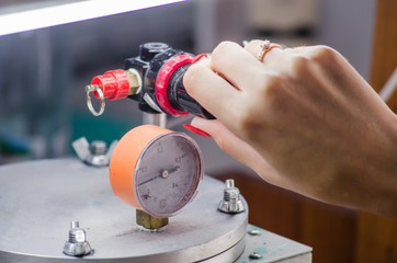 Jeweler working with wax model ring in his workshop. Craft jewelery making. Close up
