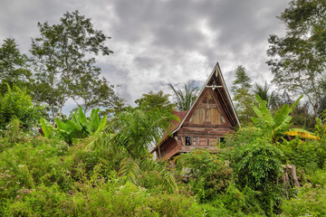 Beautiful view of a traditional Toba Batak house on the island Samosir in Lake Toba, Sumatra, Indonesia