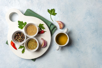Set of fragrant spices on a wooden white Board. Pepper, mustard seeds, herbs