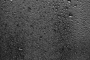 texture of a drop of rain on a glass wet transparent background