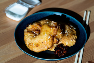 Fried Pineapple Fritters Caramelized with Cinnamon and Sesame Seeds.