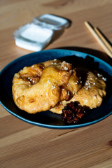 Fried Pineapple Fritters Caramelized with Cinnamon and Sesame Seeds.