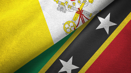 Vatican and Saint Kitts and Nevis two flags textile cloth, fabric texture