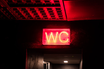 WC sign in a night club