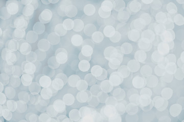 Light blue glitter background with holiday sparkle glowing backd