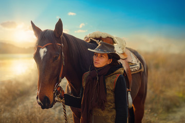 Fototapeta premium Young beautiful dreadded girl outdoors with her true horse.