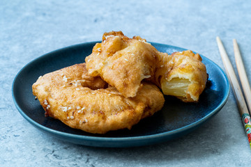 Fried Pineapple Fritters Caramelized with Cinnamon and Sesame Seeds.