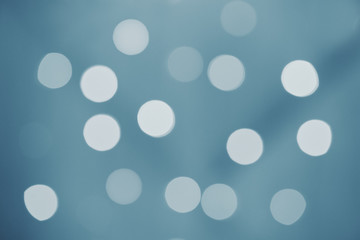 Gray blue bokeh sparkle of lights on abstract background