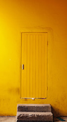 old wooden yellow door