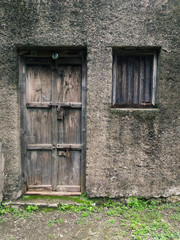 old wooden door in brick wall
