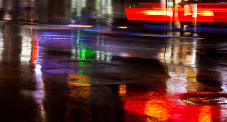 Abstract urban background. Streets after rain with reflections of light