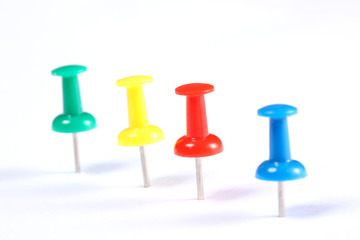 line of push pins isolated on white background with copy space for your text