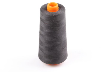 bobbin with black thread isolated on a white background