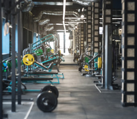 Interior of modern gym with various equipment for trainings