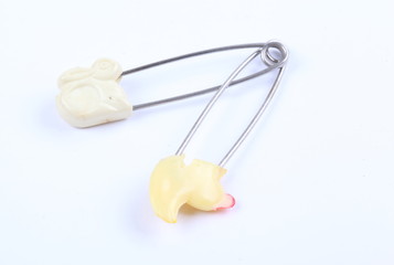 safety pins isolated on white