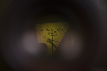 Photo through optical sight of Soviet old artillery gun. WWII period. Shallow depth of field (DOF)