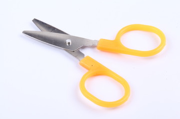 Yellow scissors isolated on a white background