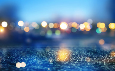 Abstract background. Defocused lights of the night city. Brilliant festive background with neon...