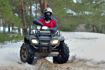 ATV and UTV driving in mud and snow at winter. Extreme, adrenalin. 4x4.