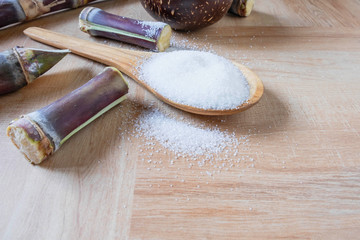 White sugar on wooden spoon