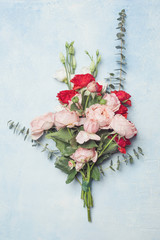 Floral bouquet arragement with rose flowers on blue background