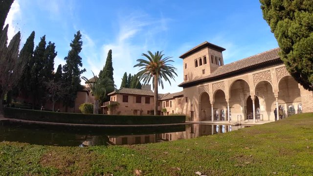 Panning view the gardens of the Partal in Alhambra Place. Granada, Andalusia, Spain. Pamoramic shot, 4K.