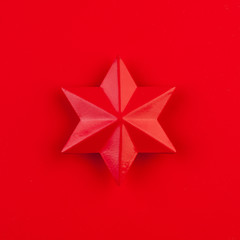 Red star on red background card