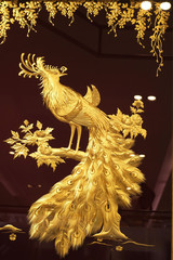 Fototapeta premium Real gold peacock image in frame