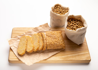 Tempe or Tempeh with soybeans on wooden board