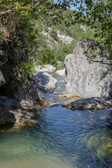 Naklejka na ściany i meble The mountain river Elikonas on a sunny day (Greece, Pieria, Mount Olympus).
