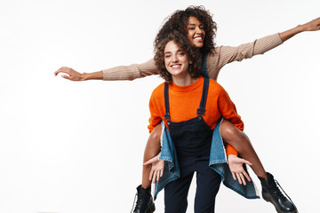 Optimistic two multiracial girls friends